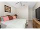 Comfortable bedroom with colorful pillows and lamps on the nightstand at 3412 Grand Vista Ct # 202, Port Charlotte, FL 33953