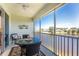 Enclosed Lanai overlooking water with ceiling fan and table and chairs at 3412 Grand Vista Ct # 202, Port Charlotte, FL 33953