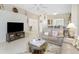 Comfortable living room with tile floors and view to dining and kitchen at 3412 Grand Vista Ct # 202, Port Charlotte, FL 33953