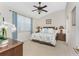 Comfortable main bedroom with ceiling fan, ensuite bathroom and neutral decor at 3412 Grand Vista Ct # 202, Port Charlotte, FL 33953
