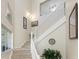 Bright staircase with tall ceilings is enhanced by the unique decor and natural lighting at 3412 Grand Vista Ct # 202, Port Charlotte, FL 33953