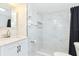 Elegant bathroom showcasing marble-like tiles, modern fixtures, and a sleek design, creating a spa-like experience at 3502 N Lincoln Ave, Tampa, FL 33607
