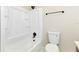 Clean bathroom featuring a tub, sleek black hardware, and white fixtures at 3502 N Lincoln Ave, Tampa, FL 33607