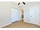 Bedroom featuring wood-look floors, a closet, and bright white walls at 3502 N Lincoln Ave, Tampa, FL 33607