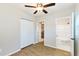 This is a bedroom with wood-look floors and ensuite bathroom access at 3502 N Lincoln Ave, Tampa, FL 33607