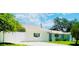 Single-story home featuring a privacy fence and landscaped yard at 3502 N Lincoln Ave, Tampa, FL 33607