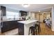 Modern kitchen featuring an island with seating, stainless steel appliances, and ample countertop space at 3502 N Lincoln Ave, Tampa, FL 33607