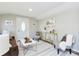 Bright living room showcases stylish seating, a decorative rug, and ample natural light, perfect for relaxation at 3502 N Lincoln Ave, Tampa, FL 33607