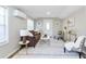 Inviting living area showcasing a comfortable brown sofa, decorative rug, and stylish accent chairs for a relaxing ambiance at 3502 N Lincoln Ave, Tampa, FL 33607