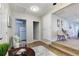 Welcoming living room with wood-look floors, neutral paint, and access to a dining area and kitchen at 3502 N Lincoln Ave, Tampa, FL 33607