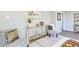 Comfortable seating arrangement with stylish chairs, a modern console table, and decorative accents for a cozy living space at 3502 N Lincoln Ave, Tampa, FL 33607