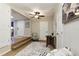 Cozy living area featuring stylish decor, ceiling fan, and wood flooring at 3502 N Lincoln Ave, Tampa, FL 33607