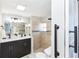 Elegant bathroom featuring double vanity, modern fixtures, and tiled walk-in shower at 3502 N Lincoln Ave, Tampa, FL 33607