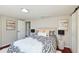 Bright bedroom featuring contemporary decor, ensuite bathroom, and ample natural light at 3502 N Lincoln Ave, Tampa, FL 33607