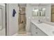 Neutral-toned bathroom showcasing a glass-enclosed shower, single sink vanity, and modern fixtures at 3715 Albacete Cir # 93, Punta Gorda, FL 33950