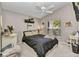 Bright bedroom featuring a large window, white furnishings, and stylish decor accents at 3715 Albacete Cir # 93, Punta Gorda, FL 33950
