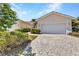 Charming single-story home with a brick driveway and manicured landscaping at 3715 Albacete Cir # 93, Punta Gorda, FL 33950