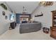 Bright living room showcases tile floors, high ceilings, a comfortable sectional, and access to the outdoor patio at 3715 Albacete Cir # 93, Punta Gorda, FL 33950