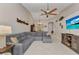 Comfortable living room with ample seating, a ceiling fan, and views into the adjacent dining area at 3715 Albacete Cir # 93, Punta Gorda, FL 33950