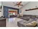 Spacious living room featuring a large sectional sofa and sliding glass doors leading to an outdoor seating area at 3715 Albacete Cir # 93, Punta Gorda, FL 33950