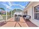 Spacious screened-in patio with outdoor seating and barbecue area, perfect for entertaining at 3715 Albacete Cir # 93, Punta Gorda, FL 33950