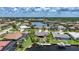 Aerial view of waterfront houses with private docks and boat lifts at 376 Portofino Dr, Punta Gorda, FL 33950