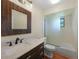 This bathroom features a marble countertop, bamboo mirror and shower with glass at 376 Portofino Dr, Punta Gorda, FL 33950