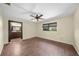 Bedroom features wood floors and an ensuite bathroom at 376 Portofino Dr, Punta Gorda, FL 33950