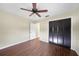 This bedroom has wood-look floors, a ceiling fan, and a spacious closet at 376 Portofino Dr, Punta Gorda, FL 33950