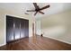 This spacious bedroom features a ceiling fan, wood floors, and closet at 376 Portofino Dr, Punta Gorda, FL 33950