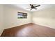Bright bedroom features wood floors and a window to let the natural light shine in at 376 Portofino Dr, Punta Gorda, FL 33950