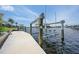 A modern boat lift on the property's private dock, providing convenience for waterfront living at 376 Portofino Dr, Punta Gorda, FL 33950