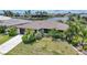 Beautiful waterfront home with lush landscaping, tile roof, and private boat dock at 376 Portofino Dr, Punta Gorda, FL 33950