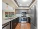 Modern kitchen featuring stainless steel appliances, undermount sink, and decorative lighting at 376 Portofino Dr, Punta Gorda, FL 33950