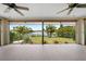 This lanai overlooks the lush yard and canal, and features sunshades at 376 Portofino Dr, Punta Gorda, FL 33950