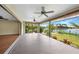 This lanai has sliding glass doors overlooking the lush landscaping and canal at 376 Portofino Dr, Punta Gorda, FL 33950
