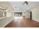 Open-concept living area with laminate flooring, ceiling fans, and water views at 376 Portofino Dr, Punta Gorda, FL 33950