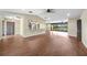 Spacious living room with laminate flooring, ceiling fans, and access to outdoor views at 376 Portofino Dr, Punta Gorda, FL 33950