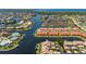 An aerial shot of waterfront condos, surrounded by canals that provide boat access to the open ocean at 3800 Bal Harbor Blvd # 415, Punta Gorda, FL 33950