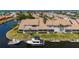 Rear exterior showing screened lanai and boat dockage on a canal at 3800 Bal Harbor Blvd # 415, Punta Gorda, FL 33950