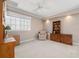 Cozy bedroom featuring ample space, a ceiling fan and a built in bookcase at 3800 Bal Harbor Blvd # 415, Punta Gorda, FL 33950