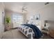 Comfortable bedroom with a large window, white furniture, and serene decor at 3800 Bal Harbor Blvd # 415, Punta Gorda, FL 33950