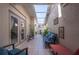 Inviting courtyard features tiled flooring, ample seating, and decorative wall art, creating a cozy outdoor living space at 3800 Bal Harbor Blvd # 415, Punta Gorda, FL 33950