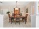 Formal dining room with chandelier, wood table, and decorative cabinet at 3800 Bal Harbor Blvd # 415, Punta Gorda, FL 33950