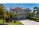 Charming home with a tile roof, lush landscaping, and a two-car garage at 3800 Bal Harbor Blvd # 415, Punta Gorda, FL 33950