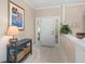 Bright and airy foyer with tiled floor, white front door, and neutral paint at 3800 Bal Harbor Blvd # 415, Punta Gorda, FL 33950