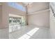 Open-concept living room with vaulted ceiling, tile floors, and views of the water at 3800 Bal Harbor Blvd # 415, Punta Gorda, FL 33950