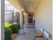 Covered walkway featuring elegant columns, lush greenery, and comfortable seating, offers a grand entrance to the home at 3800 Bal Harbor Blvd # 415, Punta Gorda, FL 33950