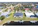 Aerial view of a waterfront home with a private dock, boat, and a screened-in pool in a charming neighborhood at 3907 San Pietro Ct, Punta Gorda, FL 33950
