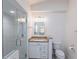 Clean, well-lit bathroom with granite counters, sleek fixtures, and glass-enclosed shower at 3907 San Pietro Ct, Punta Gorda, FL 33950